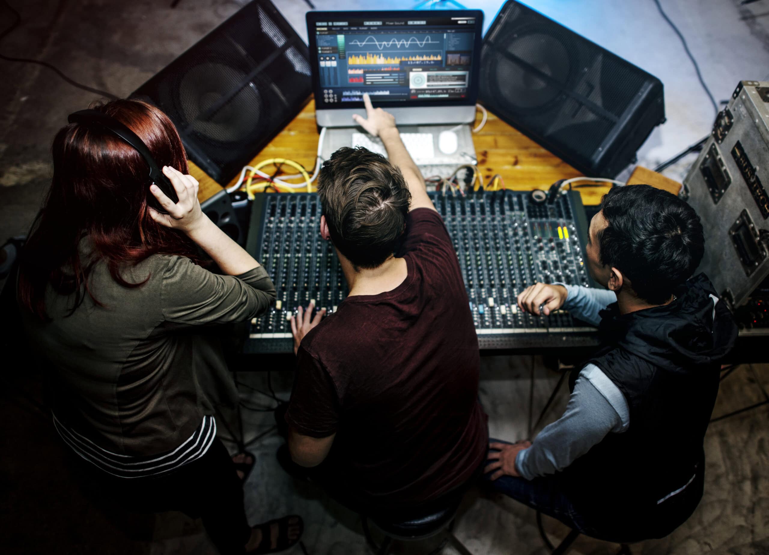 Group of people mixing their next record