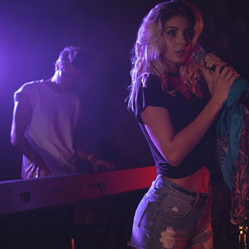 Singer and her band performing at a live event
