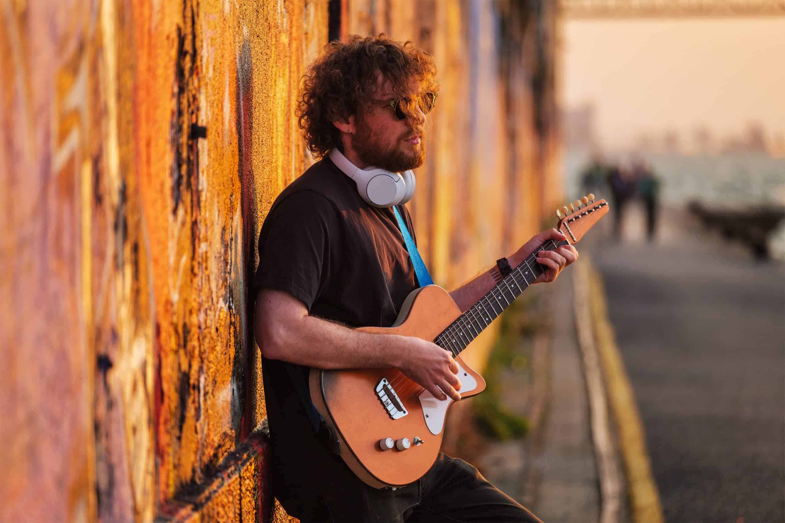 Street musician playing electric guitar in the street