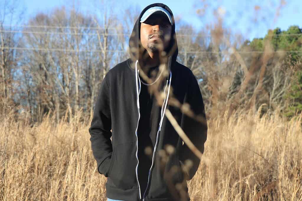 JAMES ARTISSEN in a rural field